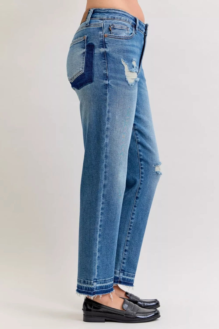 Distressed mid-rise boyfriend jeans with released raw hem
