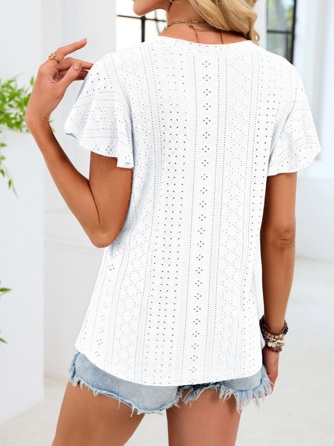 Eyelet flutter sleeve V-neck top with ruched neckline