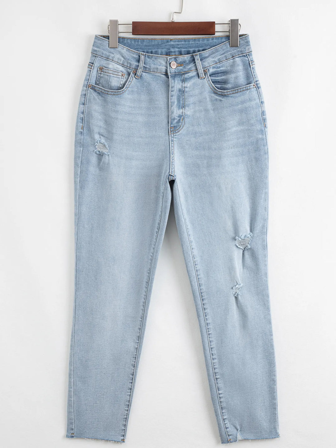 Distressed mid-rise ankle skinny jeans with raw hem