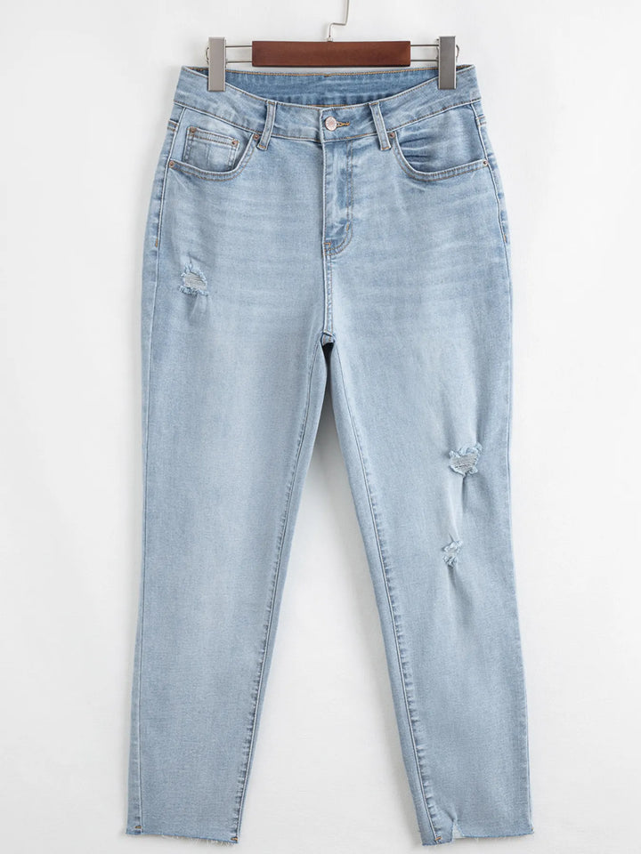 Distressed mid-rise ankle skinny jeans with raw hem