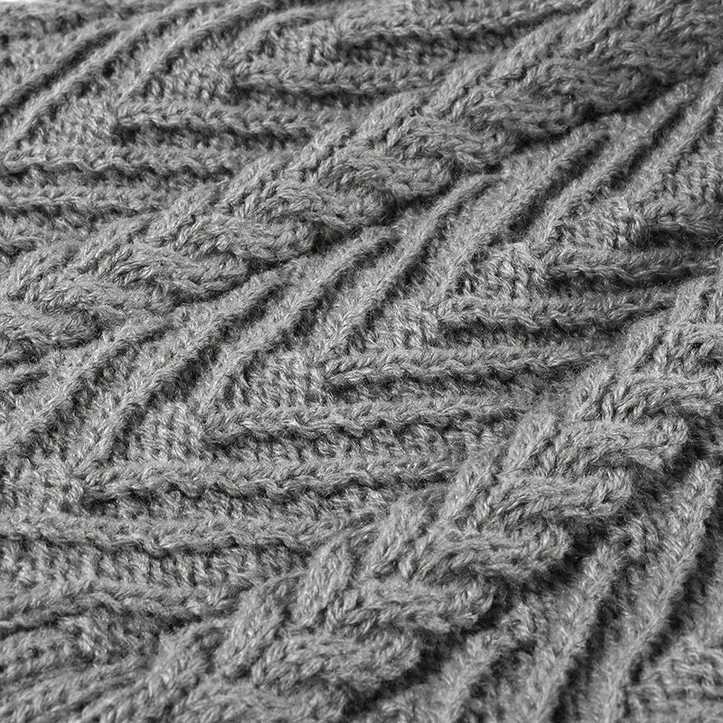 Cable knit beanie with faux fur pompom and ribbed cuff