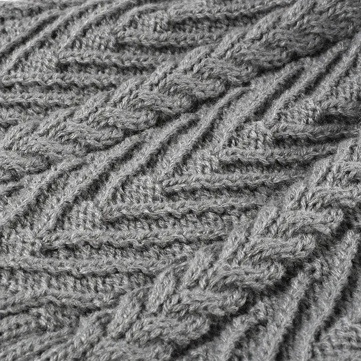 Cable knit beanie with faux fur pompom and ribbed cuff