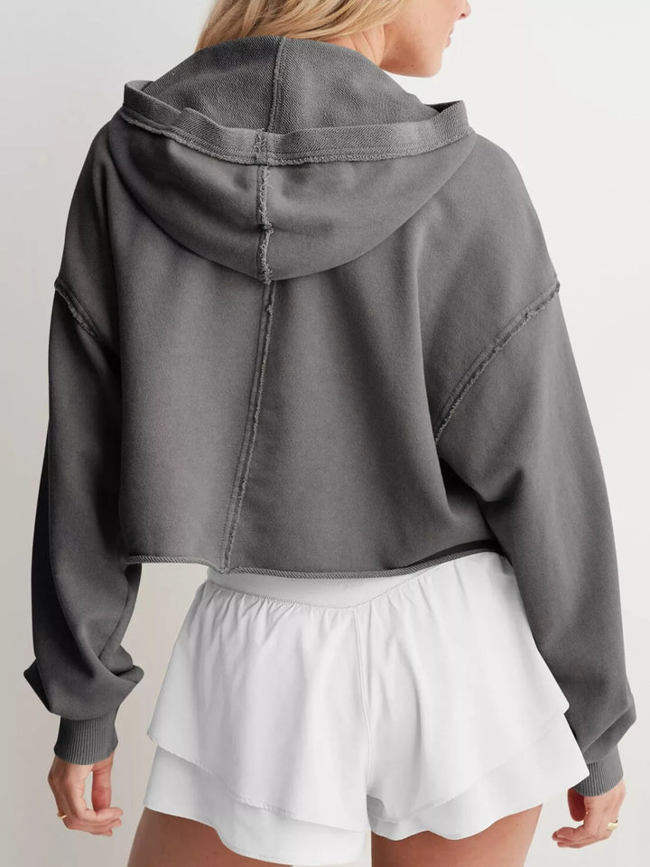 Cropped exposed-seam pullover hoodie with split neck