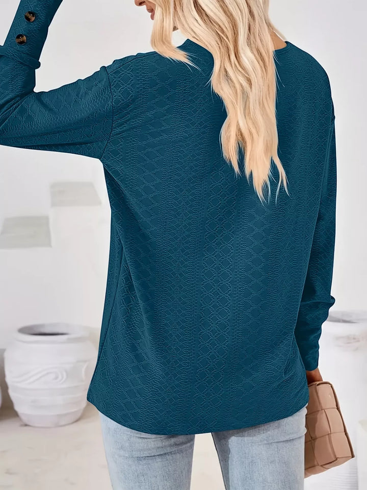 Plus size textured V-neck long sleeve top with button cuffs