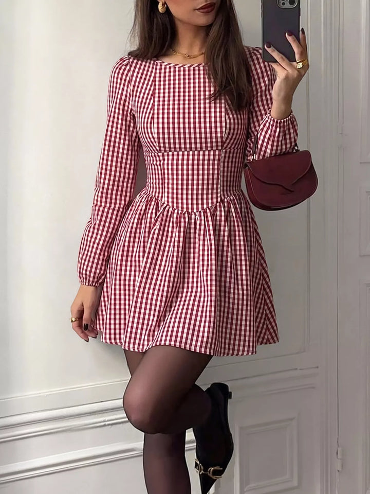Backless gingham mini dress with bow tie and puff sleeves