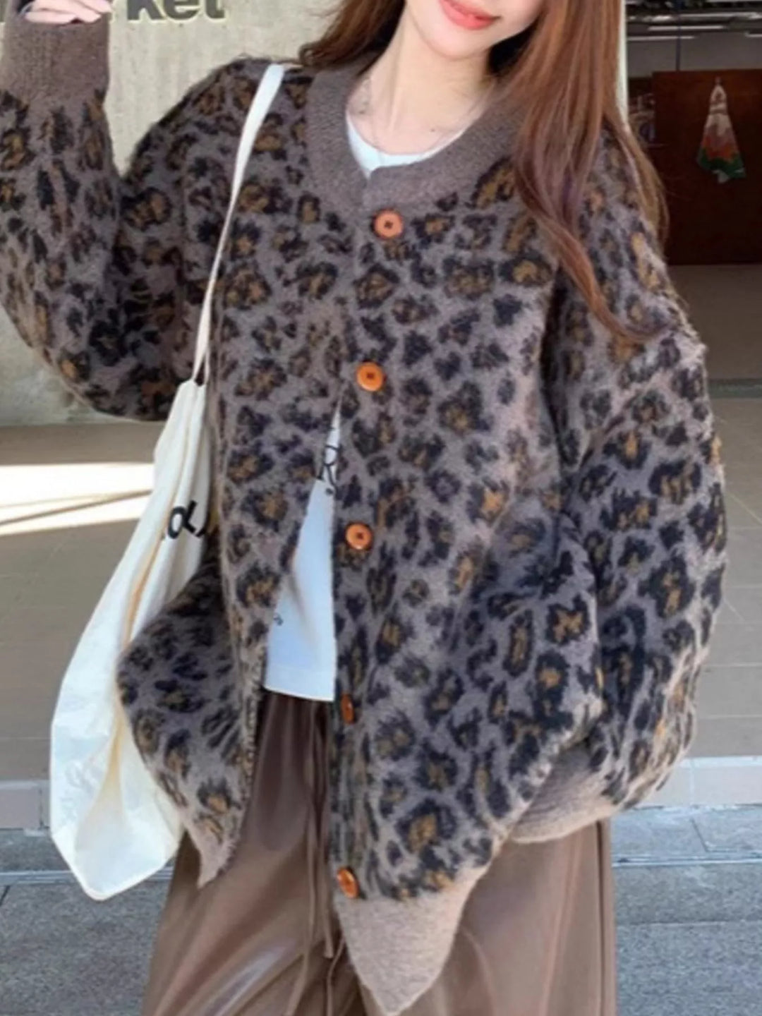 Oversized leopard print button-up knit cardigan