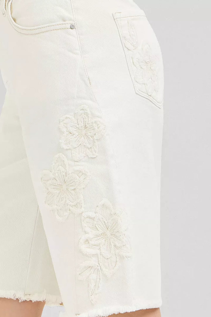 Relaxed Bermuda denim shorts with floral embroidery and raw hem