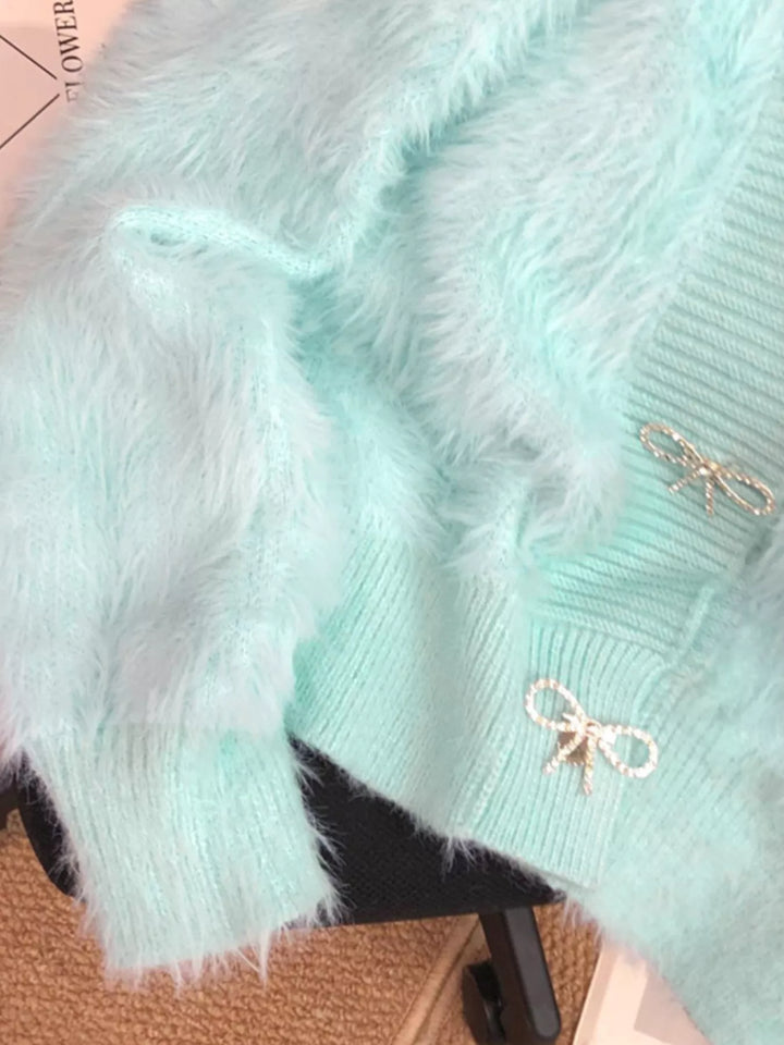 Fuzzy knit cropped cardigan with rhinestone bow buttons