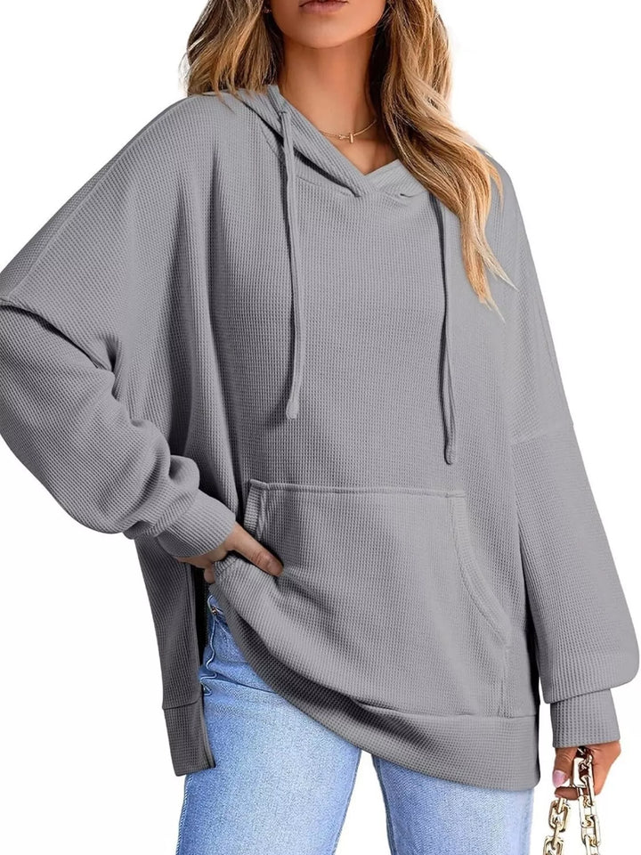 Oversized waffle-knit hoodie with side slits and front pocket