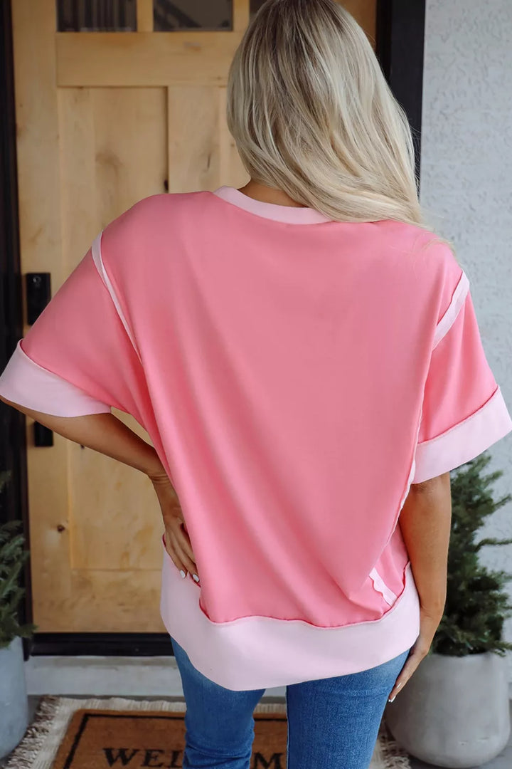 Sequin cherry and bow graphic raw seam crew neck top