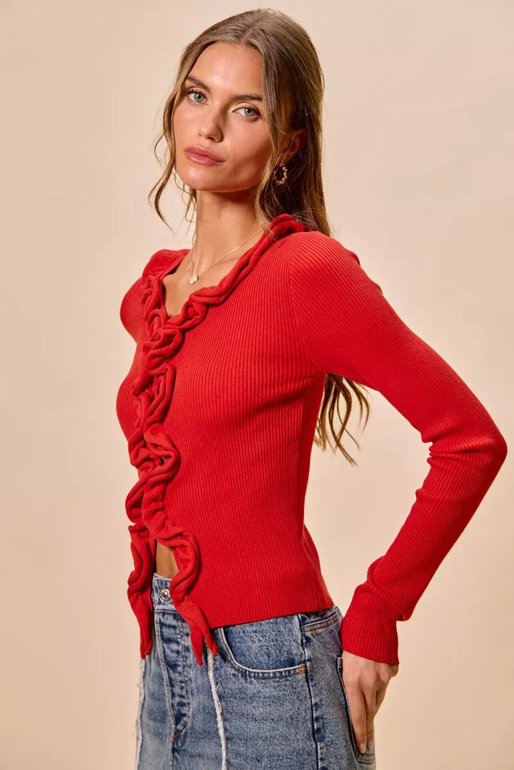 Ribbed knit cardigan with cascade ruffle trim