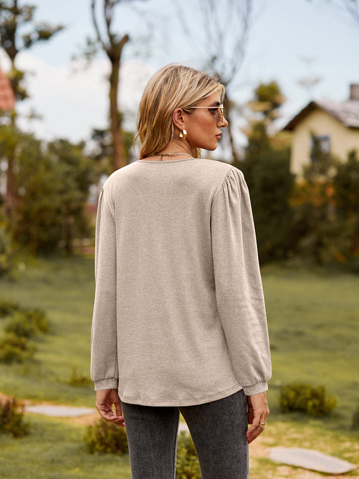 Ruffle trim puff sleeve split-neck blouse