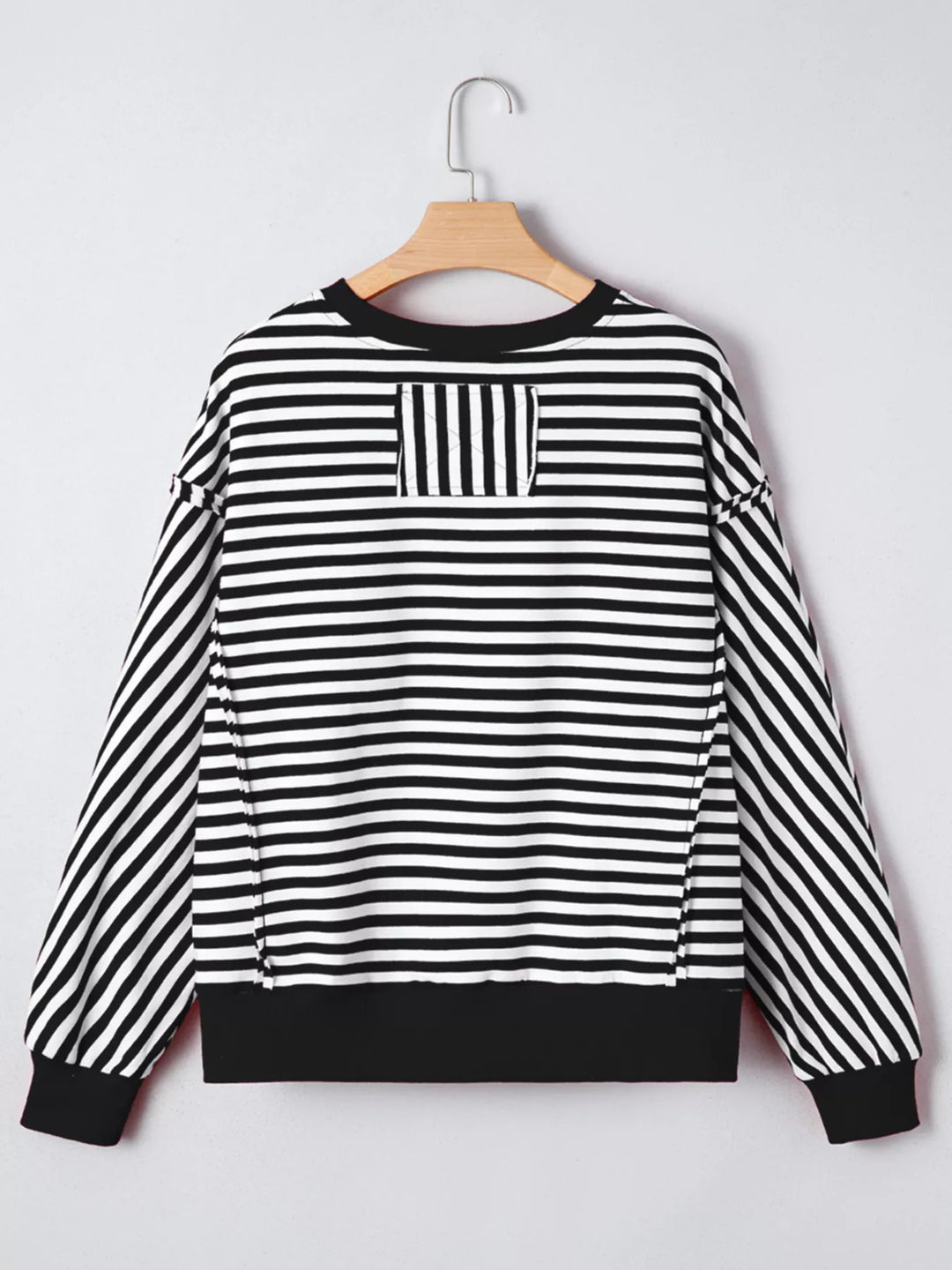 Exposed seam striped drop-shoulder pullover top