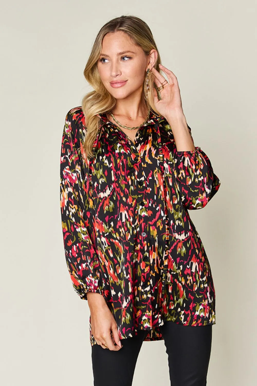 Abstract print button-up shirt with tie neck and long sleeves