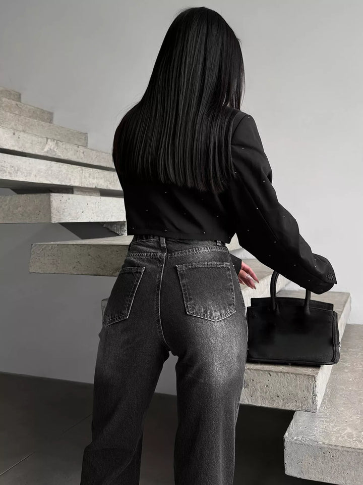 High-rise wide-leg jeans with crossover waistband and slit hem