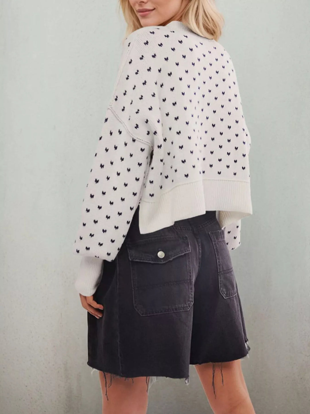 Dropped shoulder knit sweater with ribbed trim and side slits