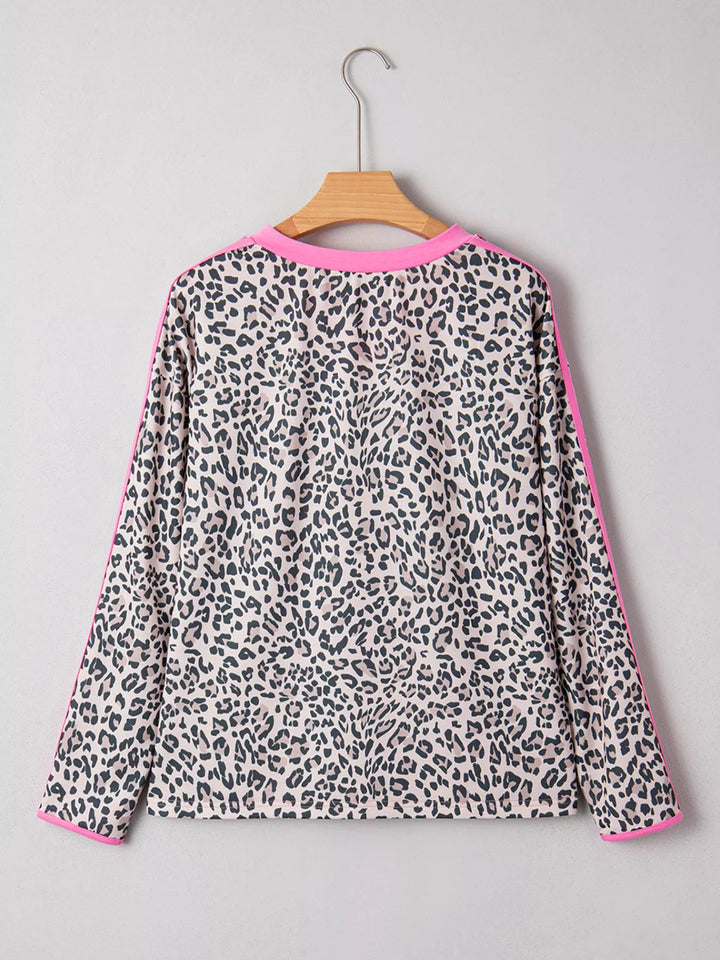 Leopard print long sleeve top with contrast V-neck trim