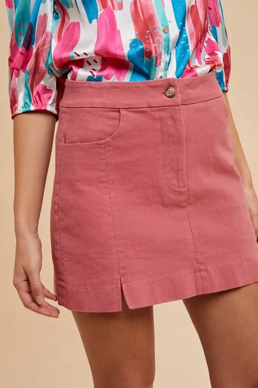 Stretch cotton mini skirt with side slits and front pockets