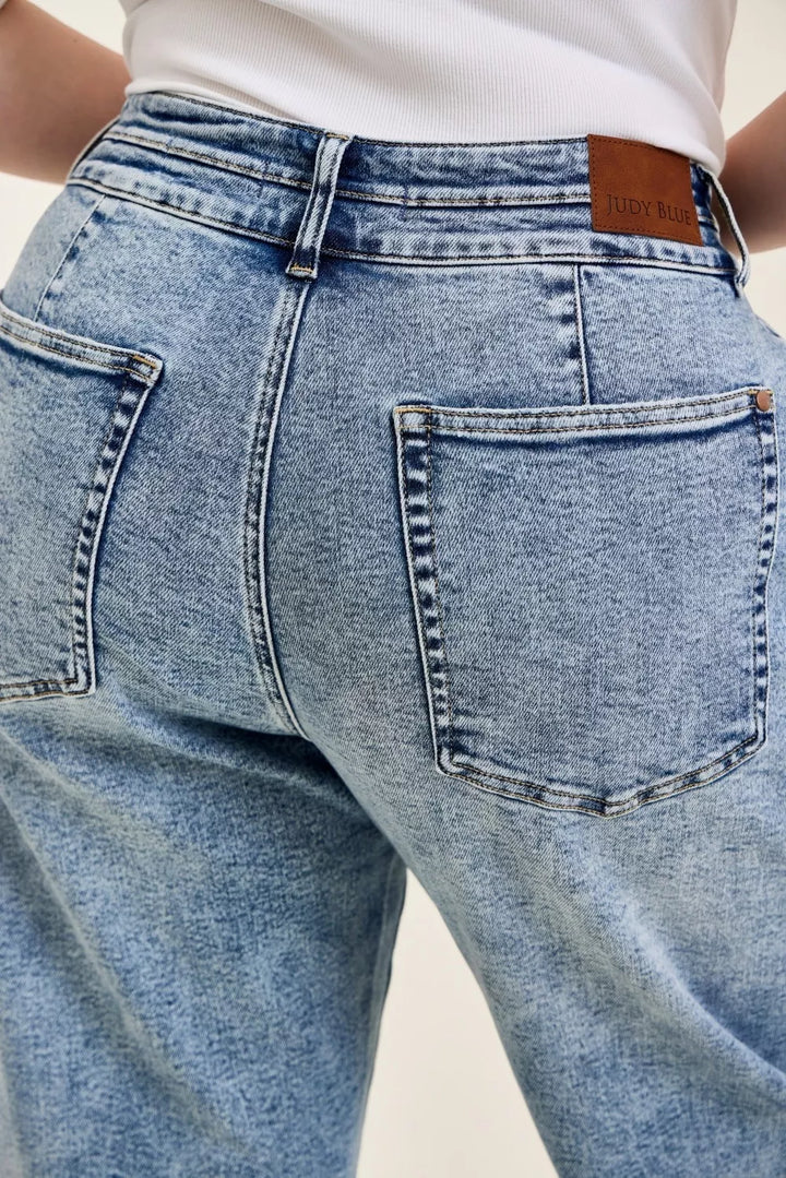 High-rise arc leg jeans with double waistband