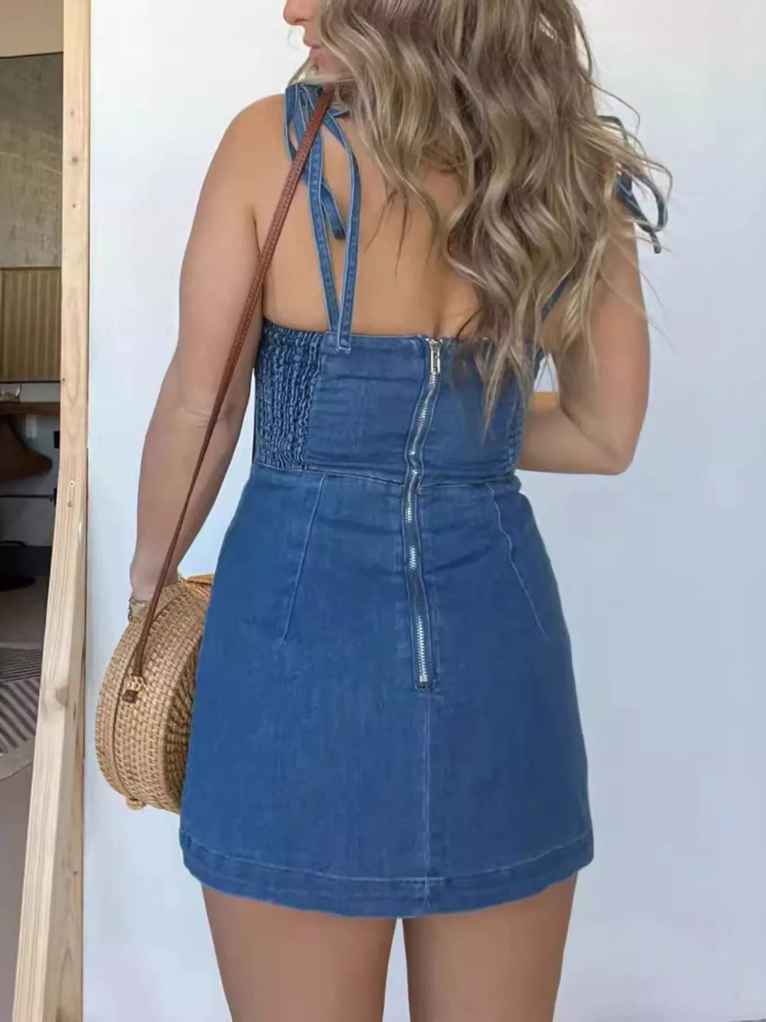 Bustier denim mini dress with tie straps and side slit