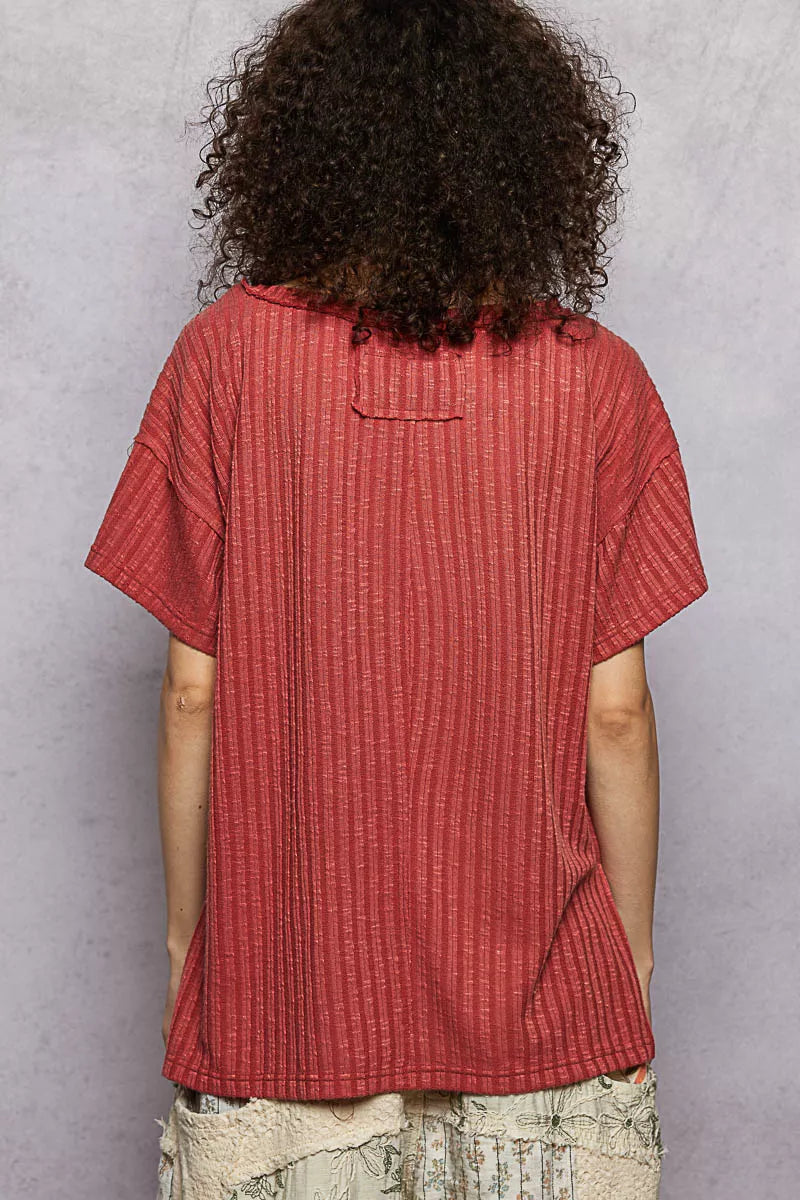 Ribbed knit V-neck tee with exposed seam and side slits