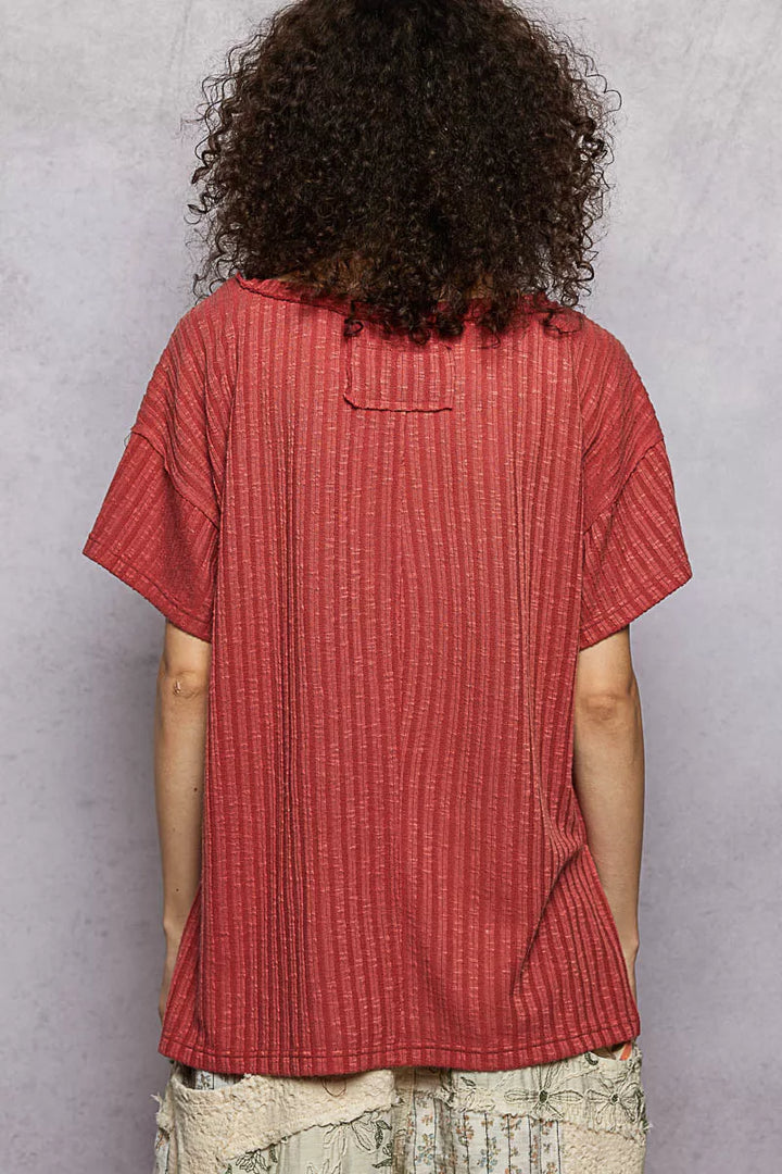 Ribbed knit V-neck tee with exposed seam and side slits