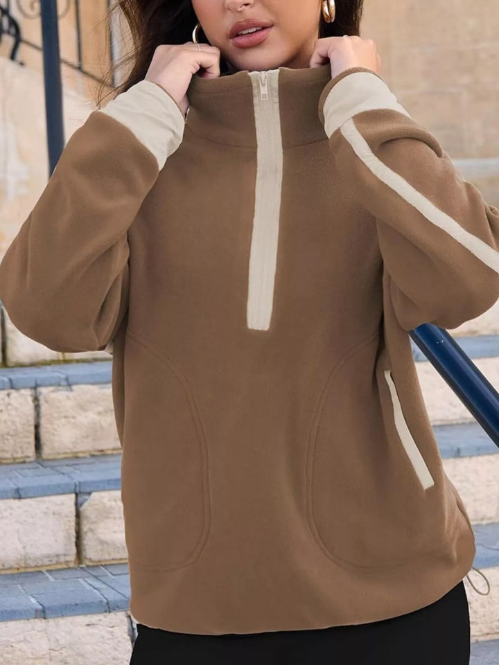 Half-zip fleece pullover with contrast trim and zip pockets