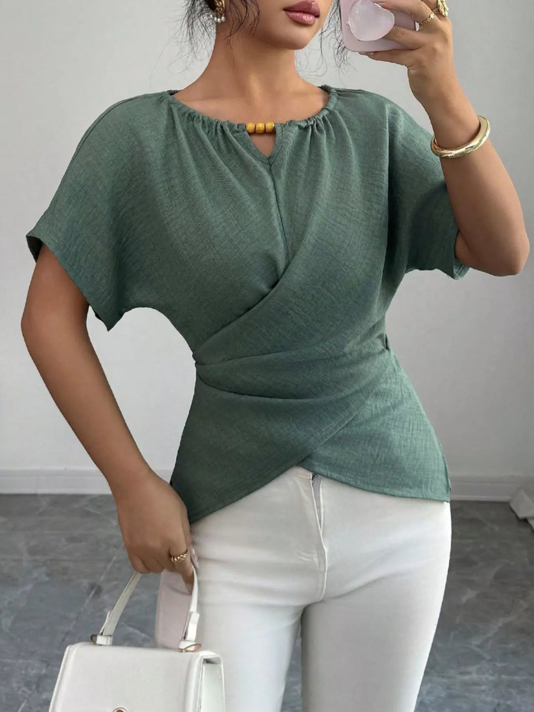 Wrap-front short sleeve blouse with beaded keyhole neckline