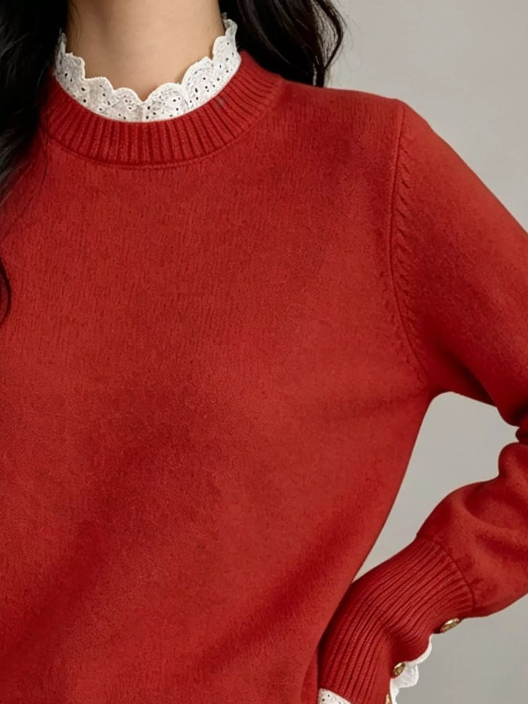 Lace trim crew neck sweater with buttoned ribbed cuffs