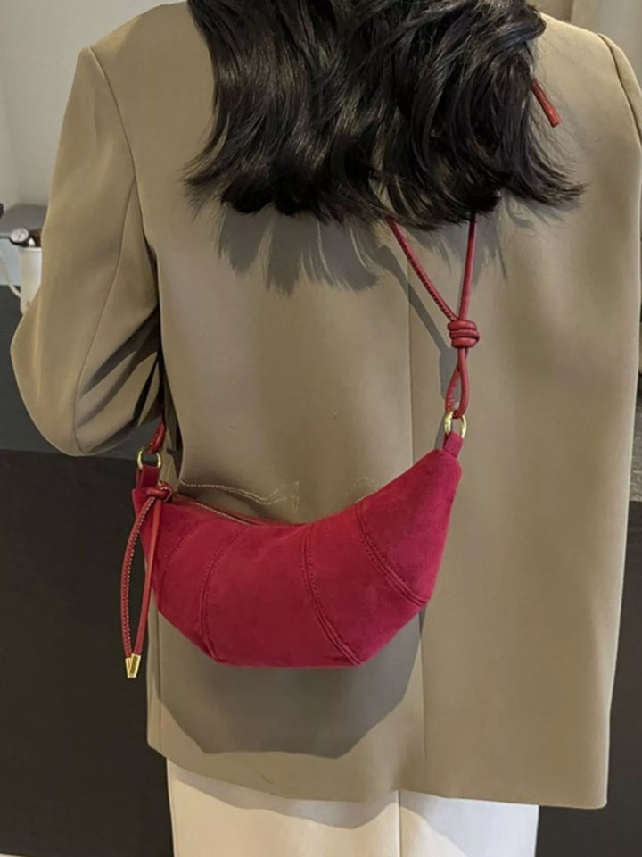 Crescent suede-look crossbody bag with knotted strap