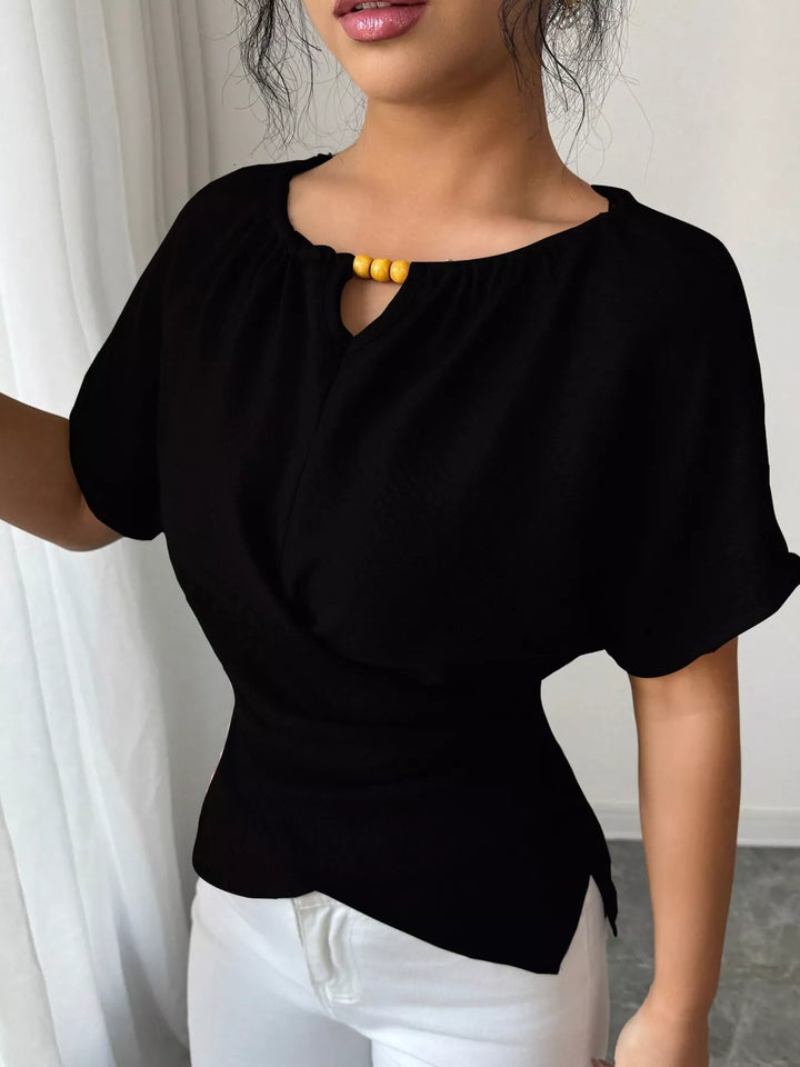 Black Wrap-front short sleeve blouse with beaded keyhole neckline