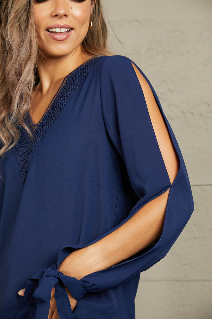 Crochet-trim V-neck blouse with slit tie-cuff sleeves