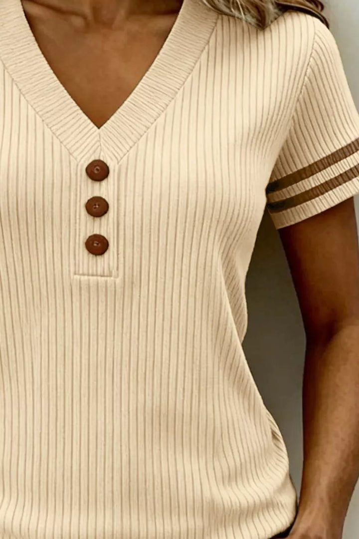 Ribbed knit V-neck top with striped sleeves and button placket