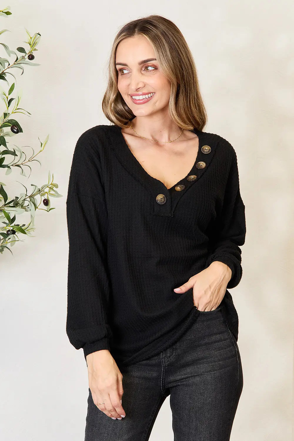 Waffle-knit henley blouse with V-neck and long sleeves