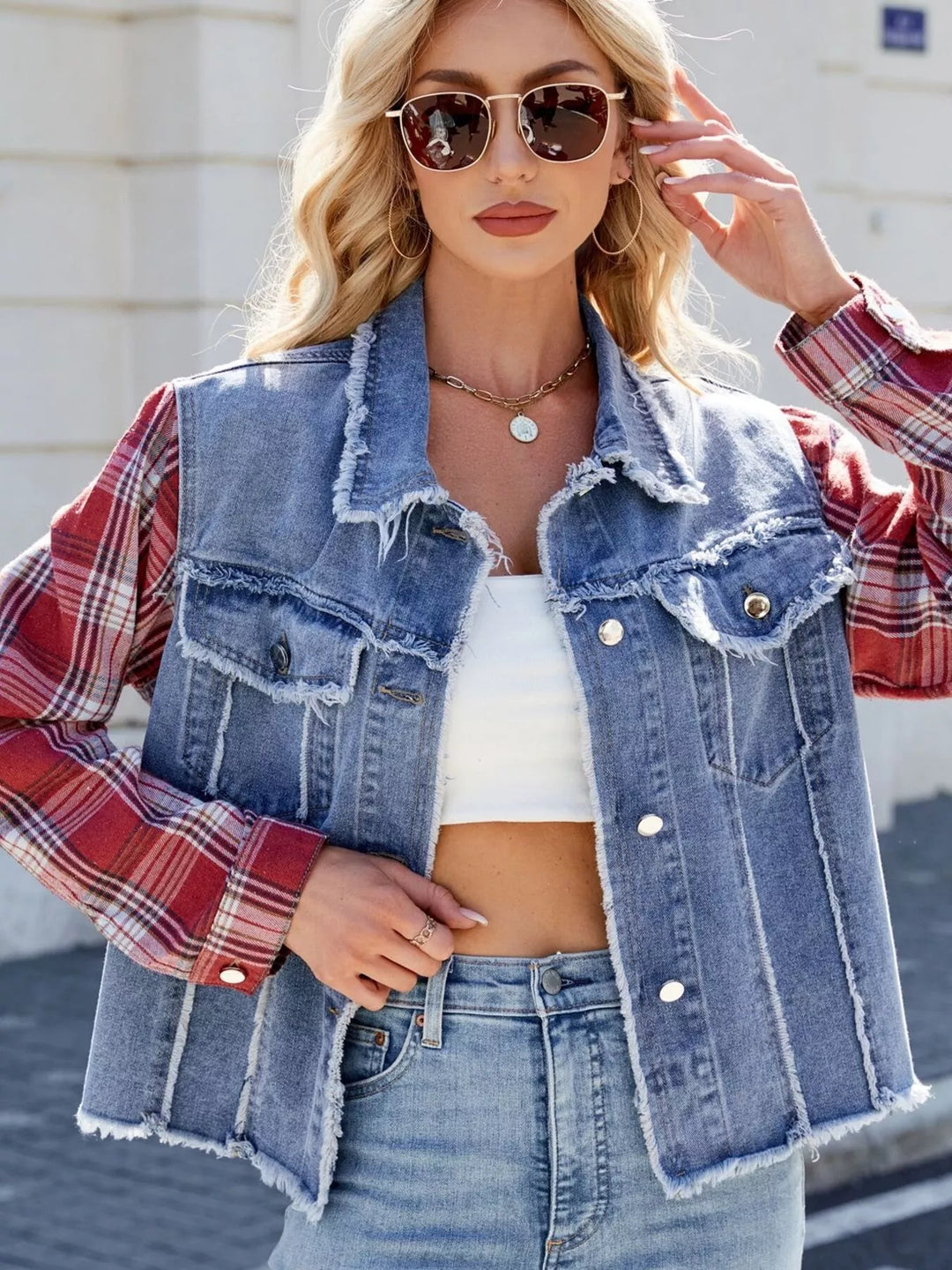 Raw hem denim jacket with plaid contrast sleeves