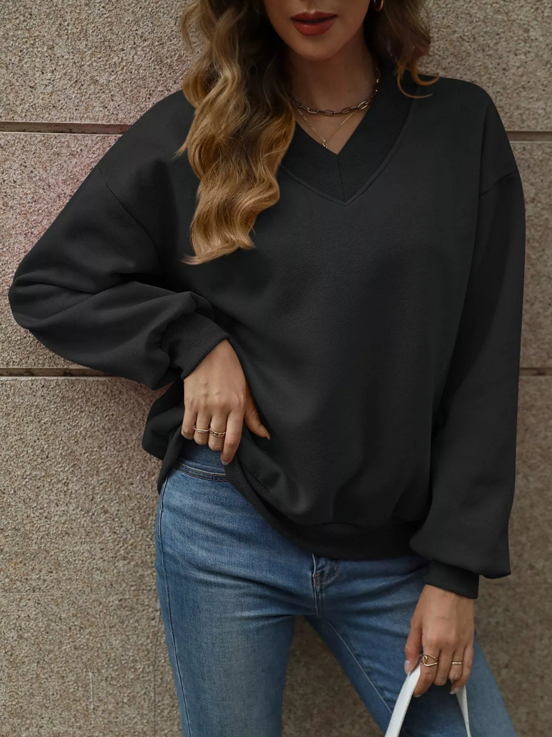 Black V-neck drop-shoulder pullover sweatshirt with ribbed trim