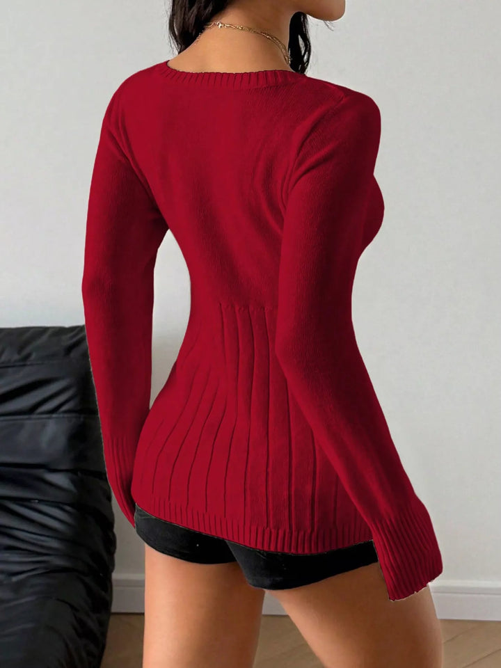 Fitted cable knit sweater with button-front placket