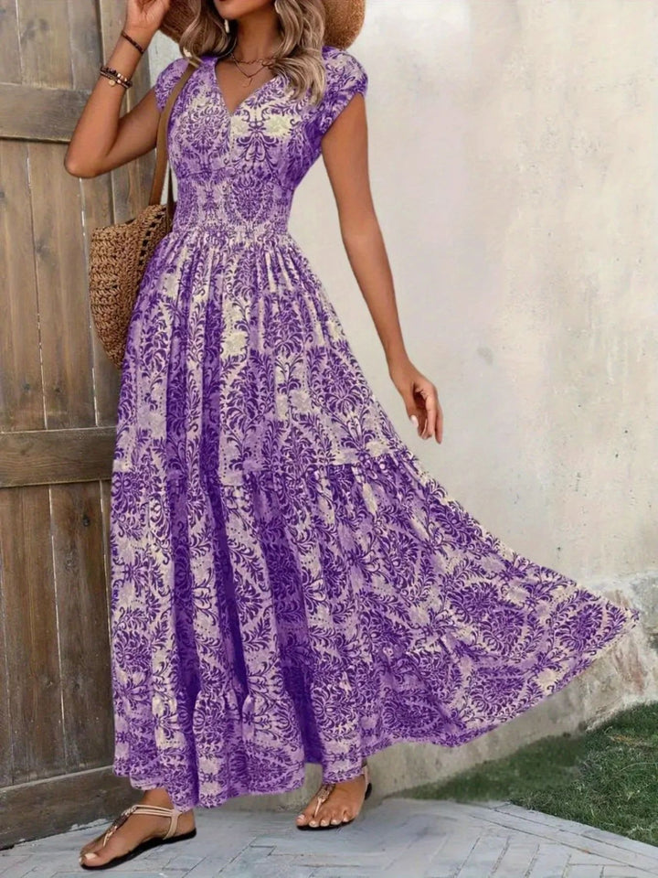 Smocked tiered maxi dress with cap sleeves and side slit