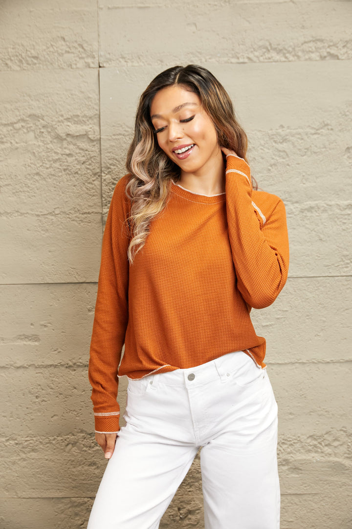 Waffle knit raglan sleeve top with ruffle cuffs