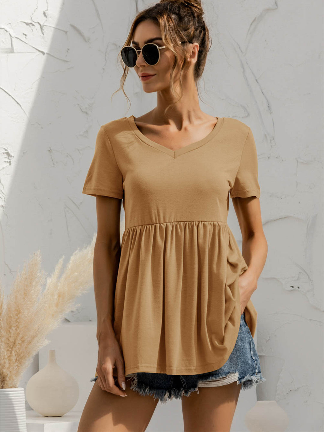 Khaki V-neck babydoll top with short sleeves and empire waist