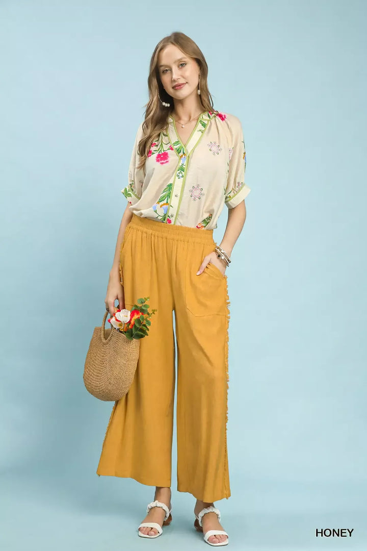 Wide-leg linen blend pants with frayed side trim and patch pockets
