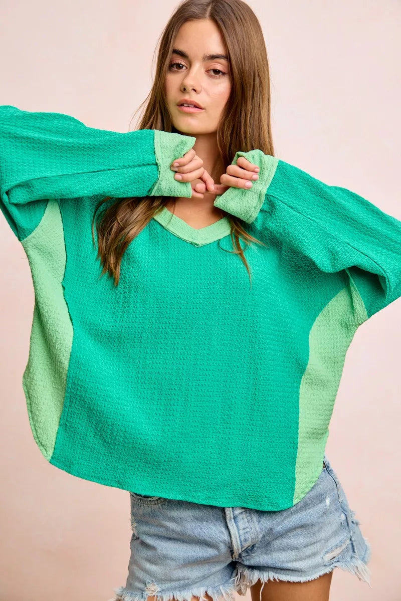 Color block long sleeve textured jersey top with raw-cut edges