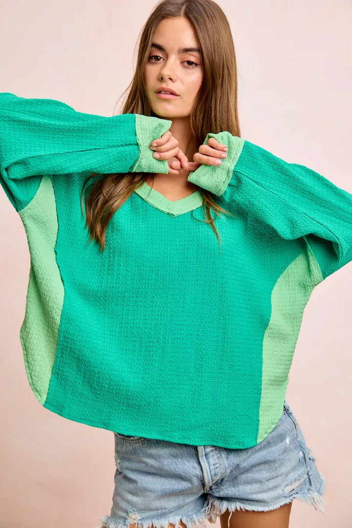 Color block long sleeve textured jersey top with raw-cut edges