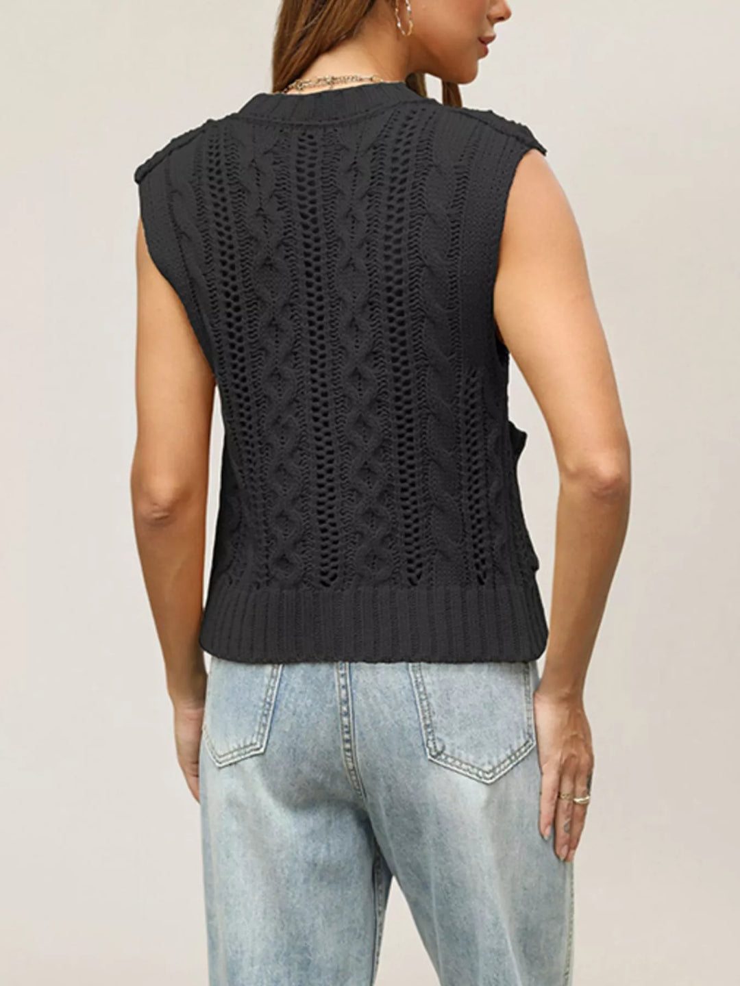Cable knit button-down sweater vest with patch pockets