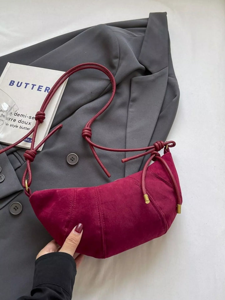 Crescent suede-look crossbody bag with knotted strap