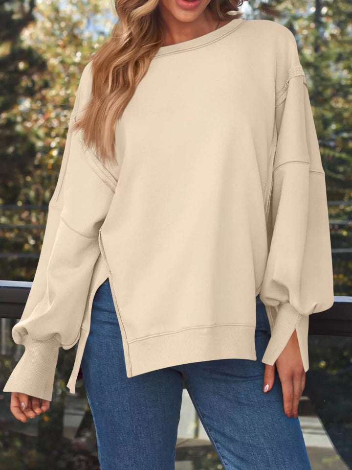 Oversized side-slit sweatshirt with exposed seams