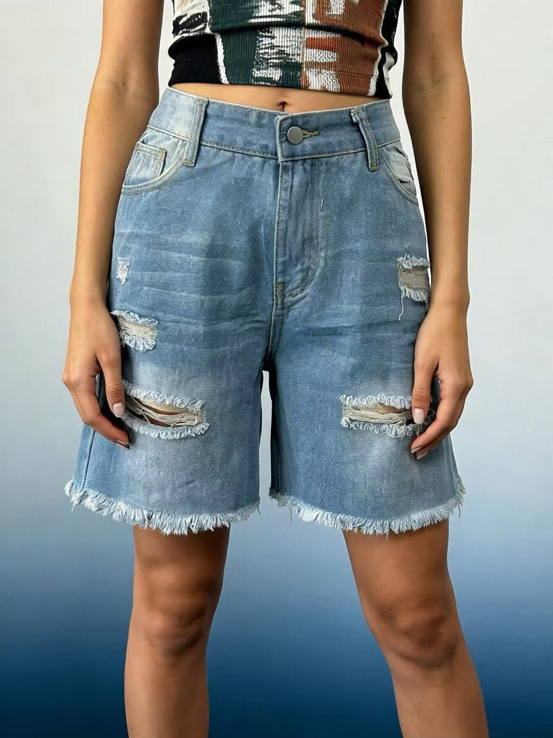 Light Blue Distressed mid-thigh denim shorts with raw frayed hem
