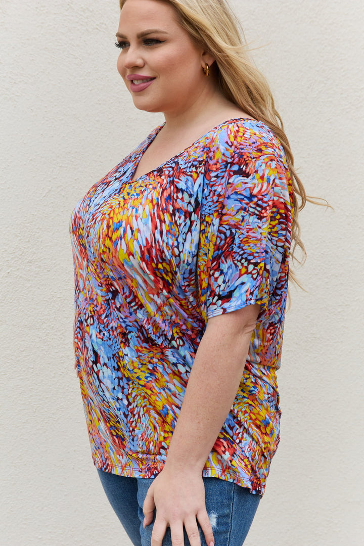 Abstract print dolman sleeve flowy V-neck top
