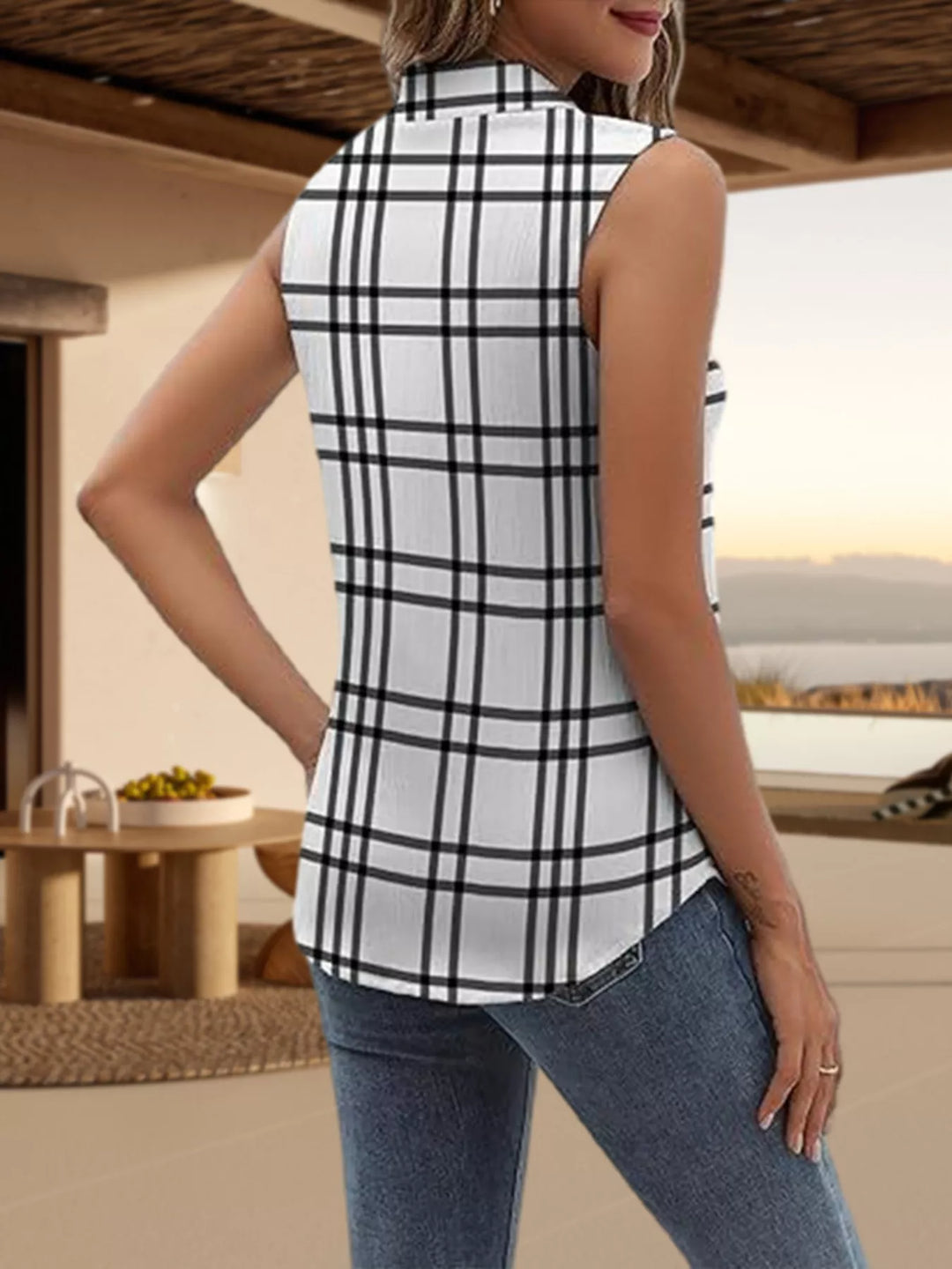 Sleeveless collared button-up shirt