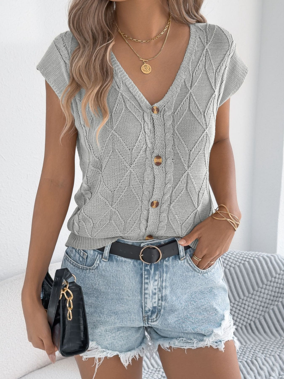 Cable knit V-neck button-down cardigan with short sleeves